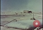 Image of atom bomb hitting oil barrels Nevada United States USA, 1955, second 57 stock footage video 65675078369