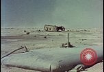 Image of atom bomb hitting oil barrels Nevada United States USA, 1955, second 58 stock footage video 65675078369