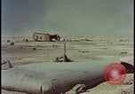 Image of atom bomb hitting oil barrels Nevada United States USA, 1955, second 60 stock footage video 65675078369