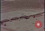 Image of army camp destroyed by atomic bomb blast test Nevada United States USA, 1955, second 3 stock footage video 65675078370