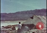 Image of army camp destroyed by atomic bomb blast test Nevada United States USA, 1955, second 11 stock footage video 65675078370