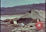 Image of army camp destroyed by atomic bomb blast test Nevada United States USA, 1955, second 13 stock footage video 65675078370
