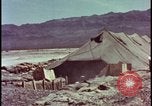Image of army camp destroyed by atomic bomb blast test Nevada United States USA, 1955, second 14 stock footage video 65675078370