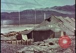 Image of army camp destroyed by atomic bomb blast test Nevada United States USA, 1955, second 15 stock footage video 65675078370