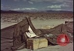 Image of army camp destroyed by atomic bomb blast test Nevada United States USA, 1955, second 46 stock footage video 65675078370