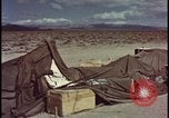Image of army camp destroyed by atomic bomb blast test Nevada United States USA, 1955, second 47 stock footage video 65675078370