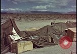 Image of army camp destroyed by atomic bomb blast test Nevada United States USA, 1955, second 49 stock footage video 65675078370