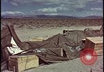 Image of army camp destroyed by atomic bomb blast test Nevada United States USA, 1955, second 50 stock footage video 65675078370