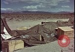 Image of army camp destroyed by atomic bomb blast test Nevada United States USA, 1955, second 51 stock footage video 65675078370