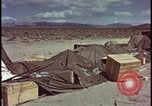 Image of army camp destroyed by atomic bomb blast test Nevada United States USA, 1955, second 52 stock footage video 65675078370
