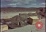 Image of army camp destroyed by atomic bomb blast test Nevada United States USA, 1955, second 53 stock footage video 65675078370