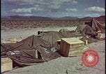Image of army camp destroyed by atomic bomb blast test Nevada United States USA, 1955, second 54 stock footage video 65675078370
