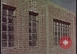 Image of atomic bomb test blast destroying buildings Nevada United States USA, 1955, second 1 stock footage video 65675078373