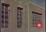 Image of atomic bomb test blast destroying buildings Nevada United States USA, 1955, second 3 stock footage video 65675078373