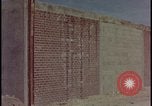 Image of atomic bomb test blast destroying buildings Nevada United States USA, 1955, second 4 stock footage video 65675078373