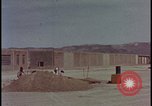 Image of atomic bomb test blast destroying buildings Nevada United States USA, 1955, second 5 stock footage video 65675078373