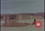 Image of atomic bomb test blast destroying buildings Nevada United States USA, 1955, second 6 stock footage video 65675078373