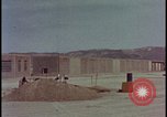 Image of atomic bomb test blast destroying buildings Nevada United States USA, 1955, second 7 stock footage video 65675078373