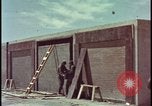 Image of atomic bomb test blast destroying buildings Nevada United States USA, 1955, second 8 stock footage video 65675078373