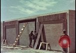 Image of atomic bomb test blast destroying buildings Nevada United States USA, 1955, second 9 stock footage video 65675078373