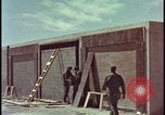 Image of atomic bomb test blast destroying buildings Nevada United States USA, 1955, second 10 stock footage video 65675078373