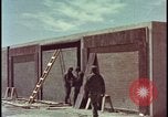 Image of atomic bomb test blast destroying buildings Nevada United States USA, 1955, second 11 stock footage video 65675078373