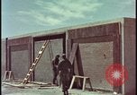 Image of atomic bomb test blast destroying buildings Nevada United States USA, 1955, second 12 stock footage video 65675078373