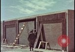 Image of atomic bomb test blast destroying buildings Nevada United States USA, 1955, second 13 stock footage video 65675078373