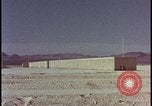 Image of atomic bomb test blast destroying buildings Nevada United States USA, 1955, second 15 stock footage video 65675078373