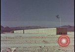 Image of atomic bomb test blast destroying buildings Nevada United States USA, 1955, second 16 stock footage video 65675078373