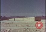 Image of atomic bomb test blast destroying buildings Nevada United States USA, 1955, second 17 stock footage video 65675078373