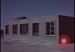 Image of atomic bomb blast hitting test building Nevada United States USA, 1955, second 23 stock footage video 65675078374