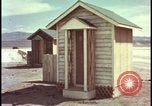 Image of atomic bomb shock wave hits huts Nevada United States USA, 1955, second 22 stock footage video 65675078378