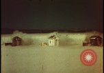 Image of atomic bomb shock wave hits huts Nevada United States USA, 1955, second 30 stock footage video 65675078378
