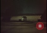 Image of atomic bomb shock wave hits huts Nevada United States USA, 1955, second 33 stock footage video 65675078378