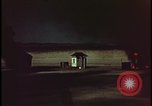 Image of atomic bomb shock wave hits huts Nevada United States USA, 1955, second 37 stock footage video 65675078378