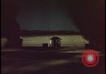 Image of atomic bomb shock wave hits huts Nevada United States USA, 1955, second 39 stock footage video 65675078378