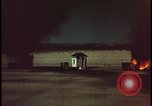 Image of atomic bomb shock wave hits huts Nevada United States USA, 1955, second 42 stock footage video 65675078378