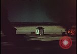 Image of atomic bomb shock wave hits huts Nevada United States USA, 1955, second 47 stock footage video 65675078378