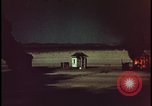 Image of atomic bomb shock wave hits huts Nevada United States USA, 1955, second 48 stock footage video 65675078378