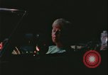 Image of elderly woman driving United States USA, 1977, second 16 stock footage video 65675078430