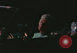 Image of elderly woman driving United States USA, 1977, second 17 stock footage video 65675078430