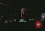 Image of elderly woman driving United States USA, 1977, second 18 stock footage video 65675078430