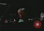 Image of elderly woman driving United States USA, 1977, second 19 stock footage video 65675078430