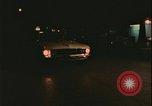 Image of elderly woman driving United States USA, 1977, second 21 stock footage video 65675078430