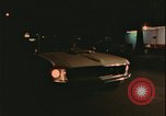 Image of elderly woman driving United States USA, 1977, second 22 stock footage video 65675078430