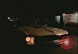 Image of elderly woman driving United States USA, 1977, second 23 stock footage video 65675078430