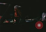 Image of elderly woman driving United States USA, 1977, second 24 stock footage video 65675078430