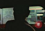 Image of elderly woman driving United States USA, 1977, second 31 stock footage video 65675078430