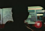 Image of elderly woman driving United States USA, 1977, second 32 stock footage video 65675078430